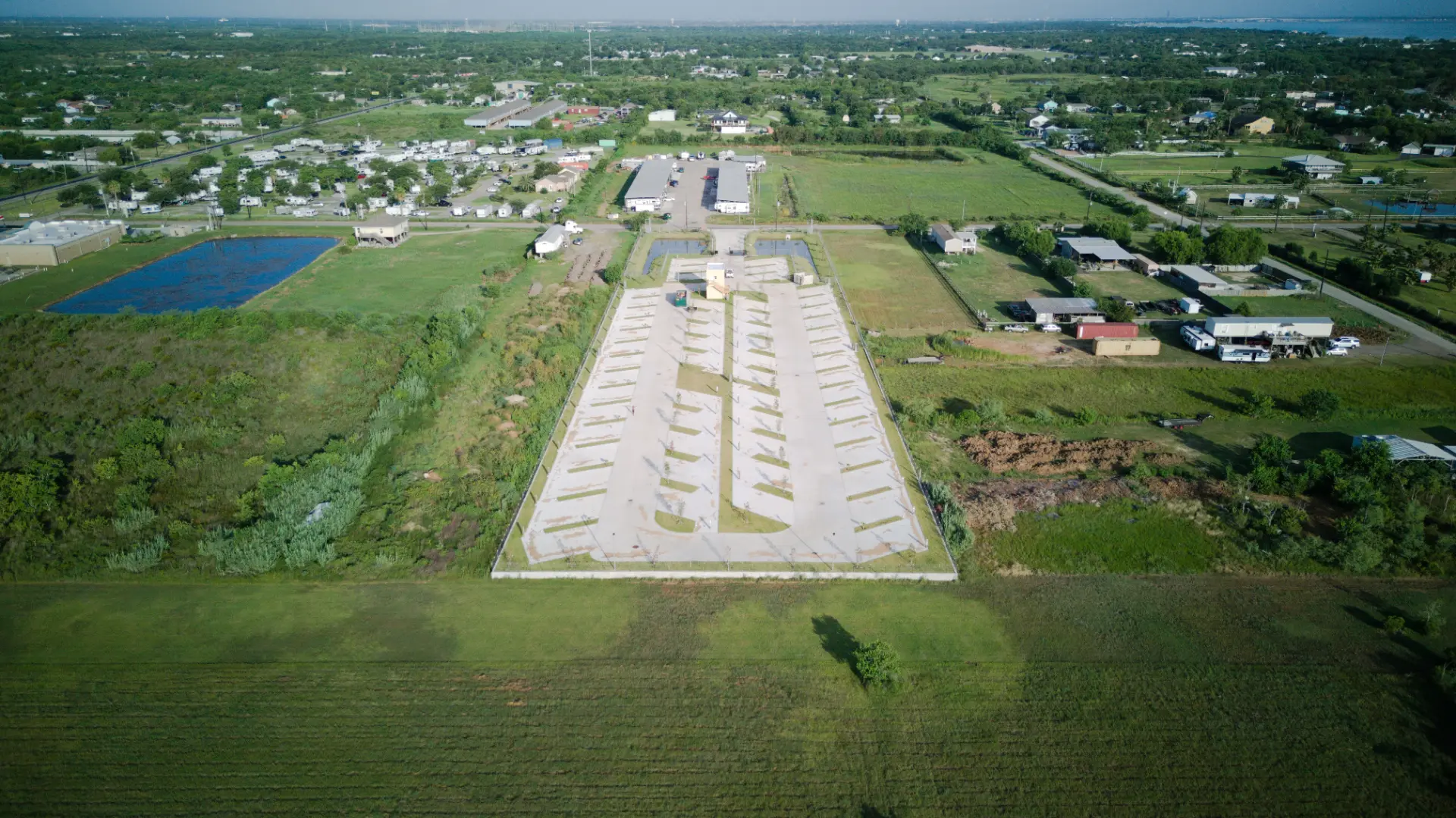 Aerial view of the park set among San Leon neighborhoods and open green fields